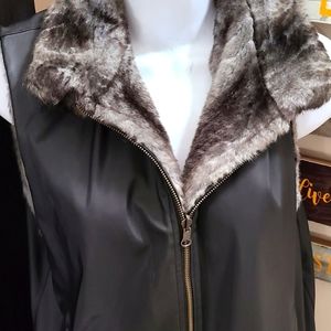 Reversible faux fur zip up vest Size large.